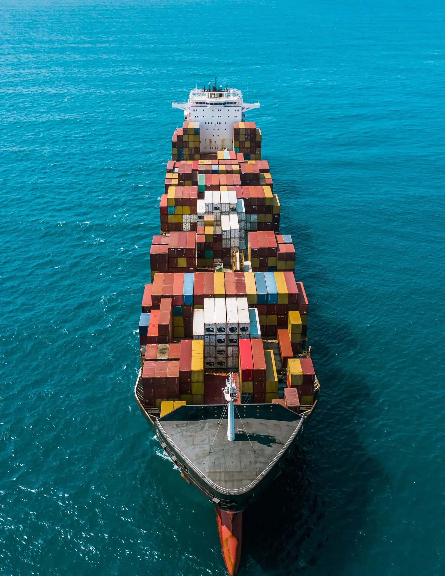 Full aerial photograph of a container vessel at sea